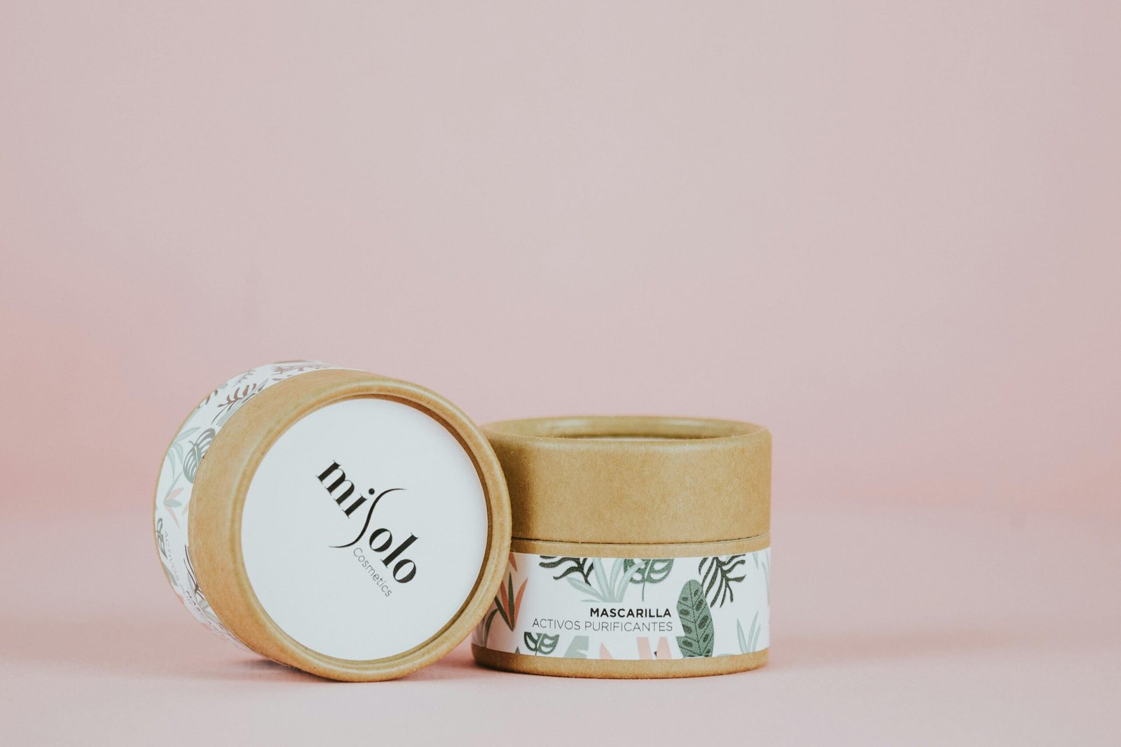Chic skincare product packaging in eco-friendly design with pastel background.